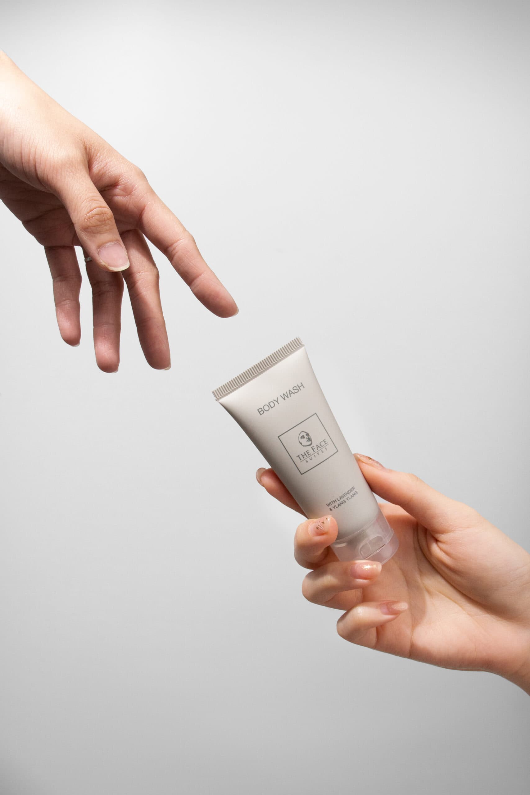 shampoo product packshot with human hand touch